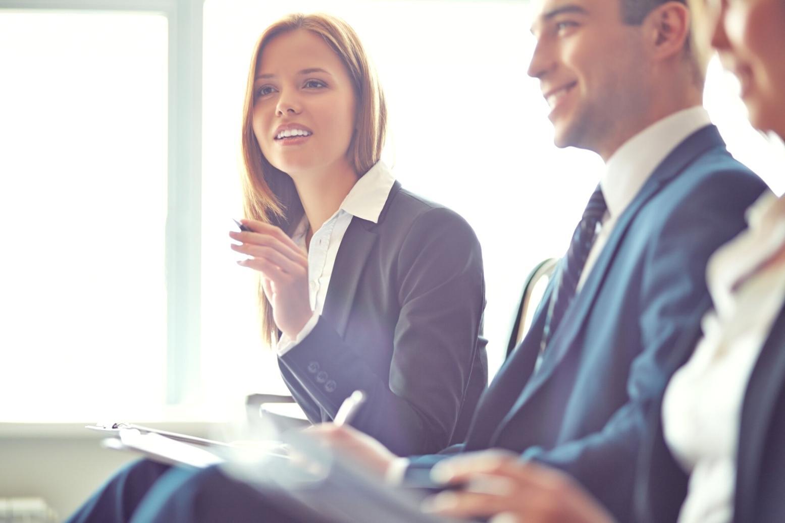 Collaborative learning session with participants working together on business concepts